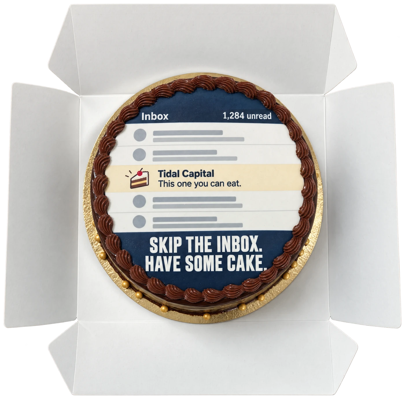 An open white bakery box holding a chocolate cake printed with an email inbox: 1,284 unread, and one message from Tidal Capital that says This one you can eat. Across the bottom: Skip the inbox. Have some cake.