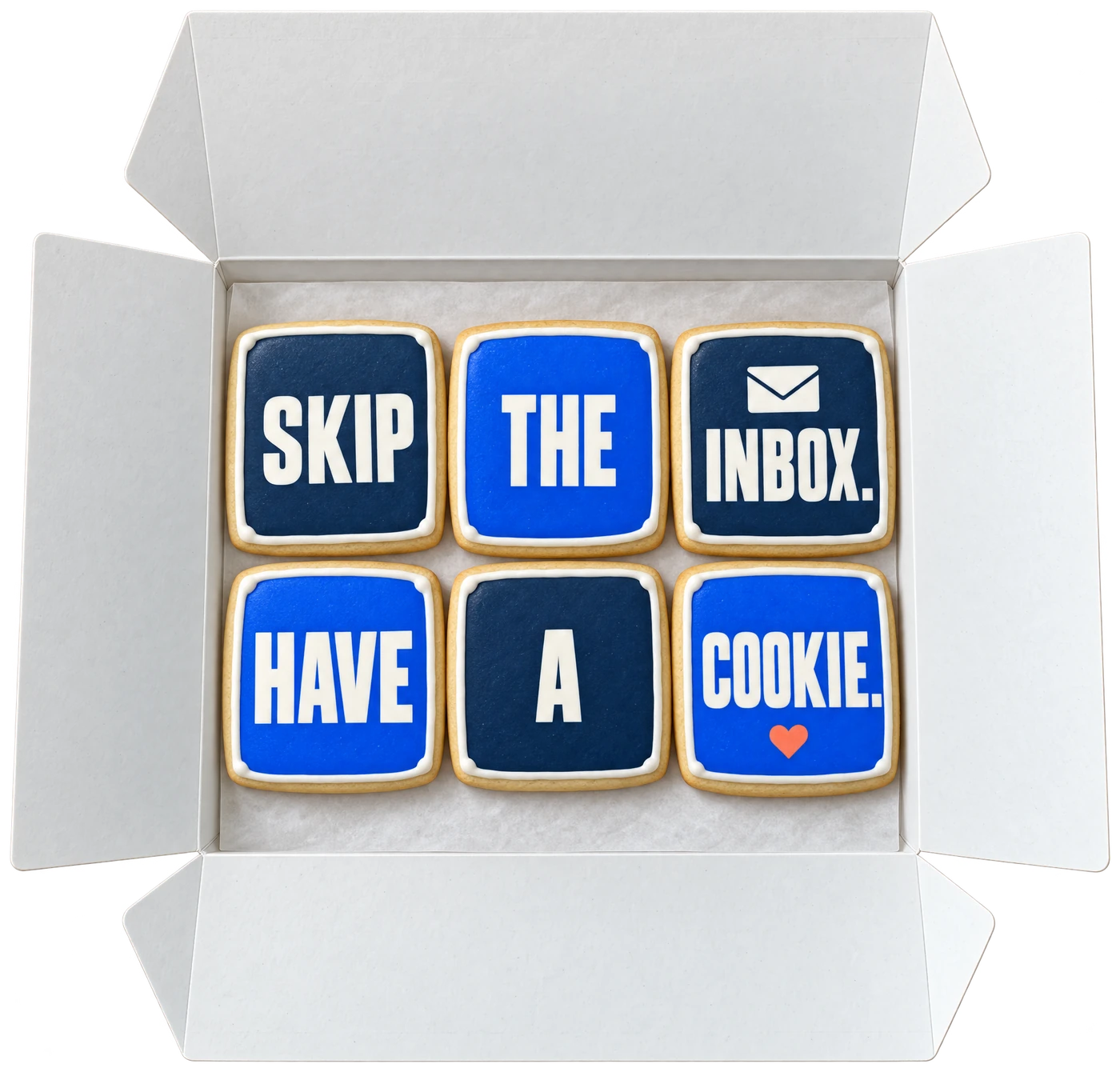 An open white box of six iced cookies spelling Skip the inbox. Have a cookie.